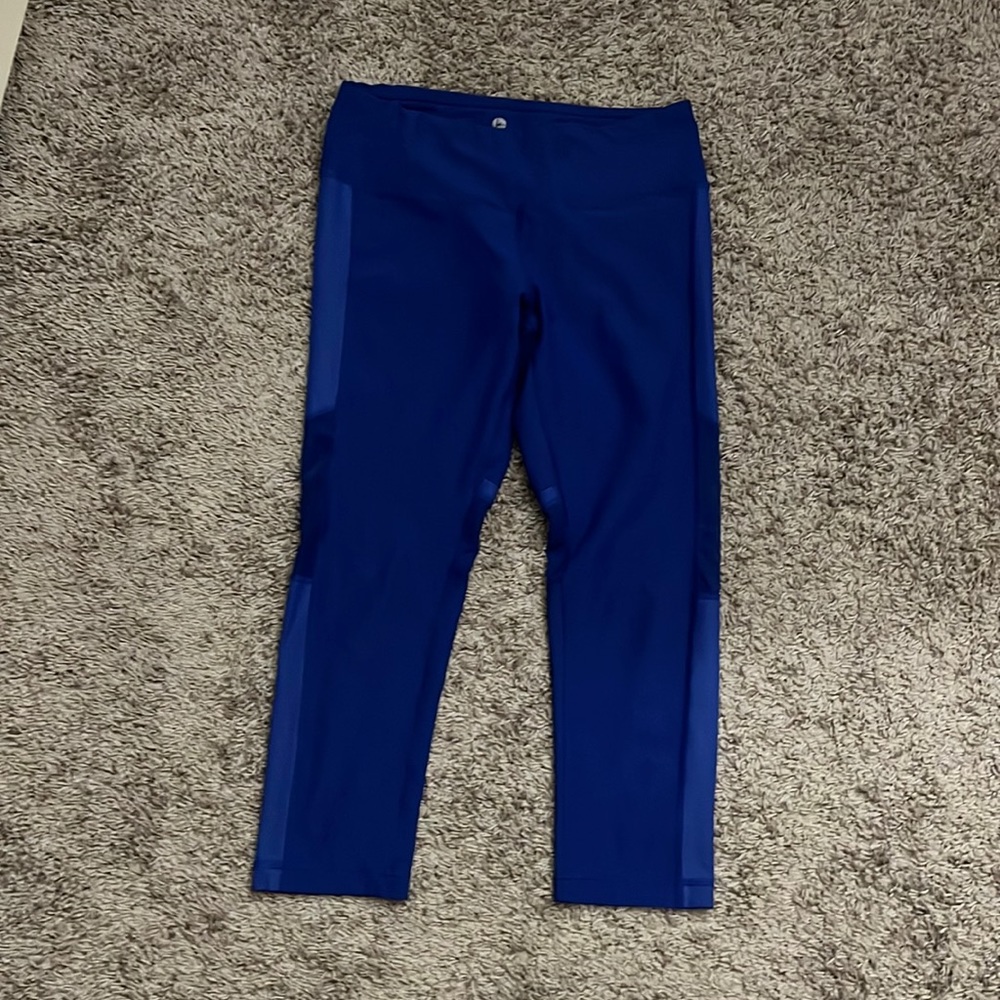 90 degree by reflex leggings with mesh on sides of legs.